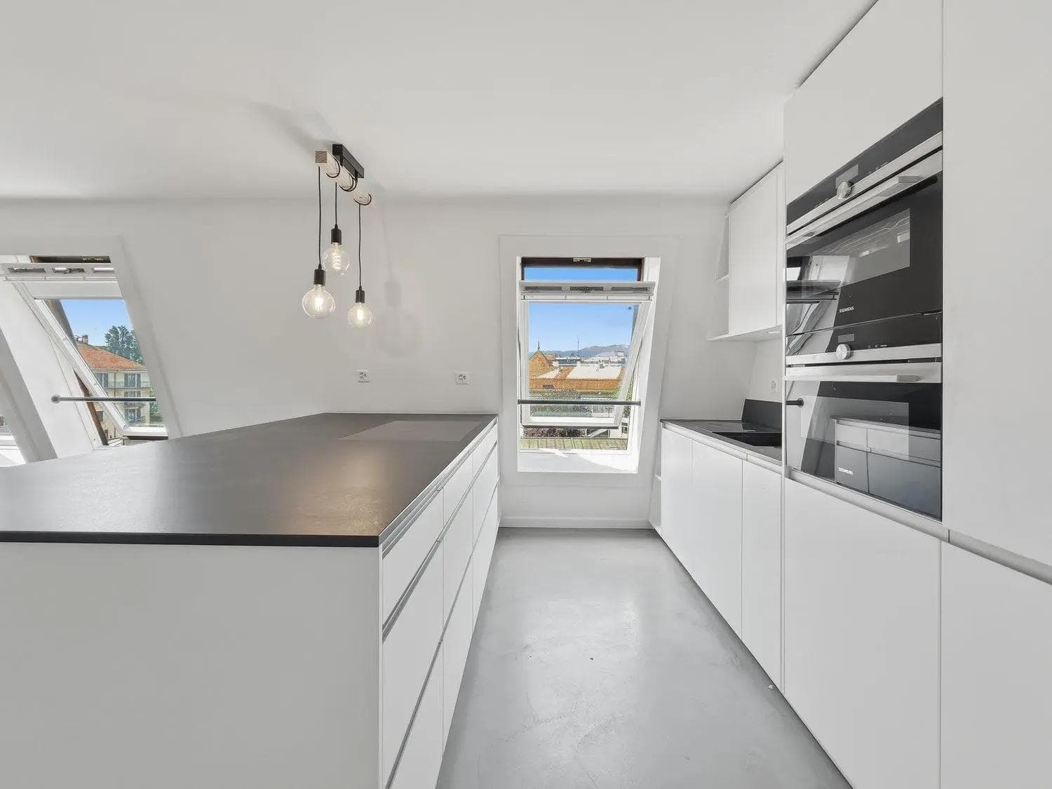 Attique moderne avec rooftop privé 80 m² – Vue panoramique Genève Attique moderne avec rooftop privé 80 m² – Vue panoramique Genève