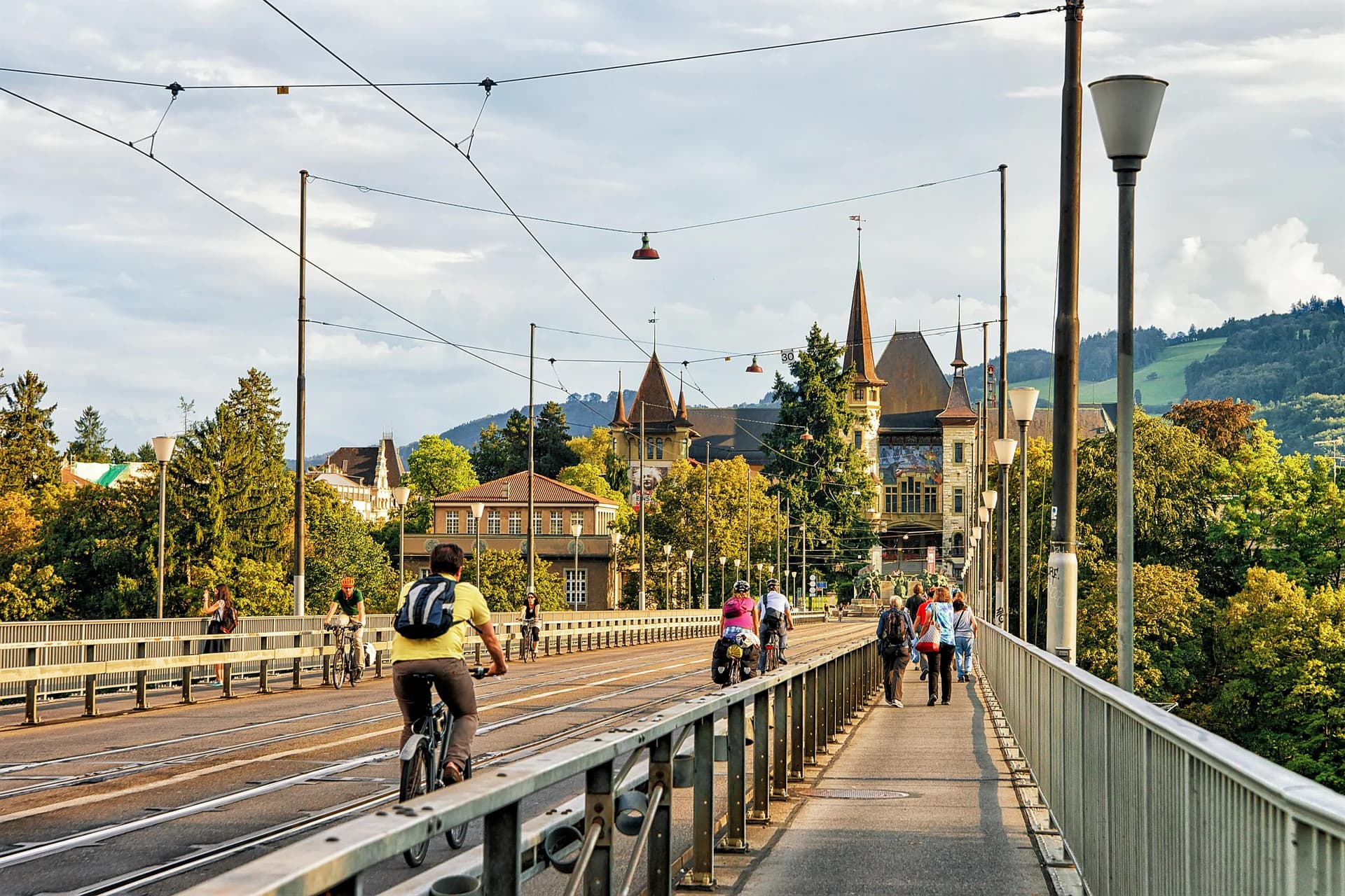 Residents are riding bicycle and walking on Kirchenfeld bridge in Bern Residents are riding bicycle and walking on Kirchenfeld bridge in Bern